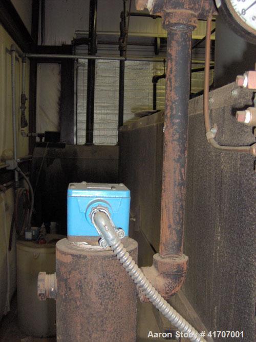 Used Parker Water Tube Boiler, Model 104-50. Natural gas, 50 hp, 1725 pounds/hour, 200 psi. Includes blowdown tank, pressure tank and all related equipment. Mfg 2000. Less than 1000 hours.