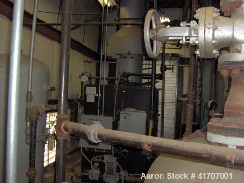 Used Parker Water Tube Boiler, Model 104-50. Natural gas, 50 hp, 1725 pounds/hour, 200 psi. Includes blowdown tank, pressure tank and all related equipment. Mfg 2000. Less than 1000 hours.