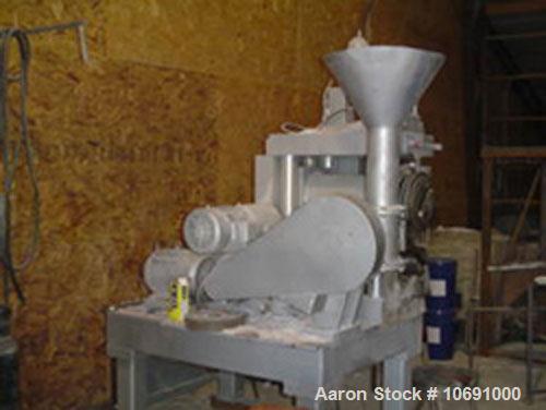 Used K R Komarek Model B220 Briquetter serial #371. With (2) 12" diameter rolls, carbon steel, feeding rolls, 10 hp 230/460 volt feeding motor, auger 3 hp 230/460 motor. 3000 psi (Max operating press...