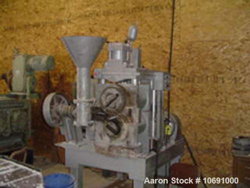 Used K R Komarek Model B220 Briquetter serial #371. With (2) 12" diameter rolls, carbon steel, feeding rolls, 10 hp 230/460 volt feeding motor, auger 3 hp 230/460 motor. 3000 psi (Max operating press...