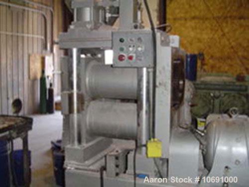 Used K R Komarek Model B220 Briquetter serial #371. With (2) 12" diameter rolls, carbon steel, feeding rolls, 10 hp 230/460 volt feeding motor, auger 3 hp 230/460 motor. 3000 psi (Max operating press...