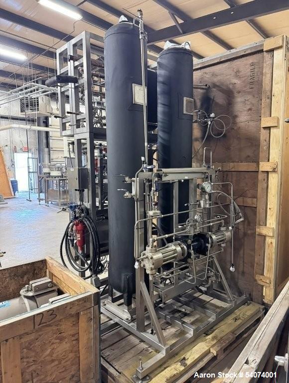 Used Vitalis R-Series CO2 Extraction System. Consisting of: Model R200H Extractor Assembly; Accumulator/Pump & Refrigeration Assembly; Hydraulic Power Unit; Control Panels; Navien Tankless Water Heat...