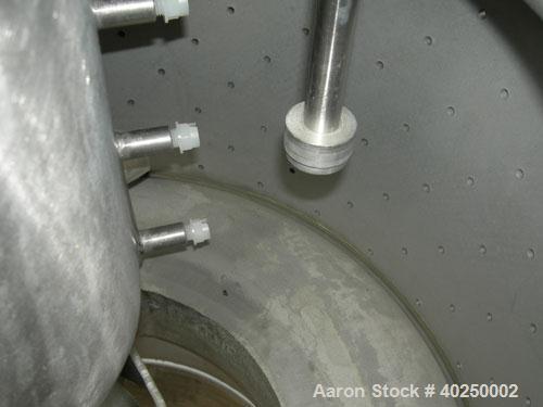 Used Delaval/ATM 24" x 14" perforated basket centrifuge, Hastelloy C-276 construction (product contact areas). Max bowl speed 1475 rpm, top feed, bottom unload, 2.1875 cubic foot basket cake solids c...