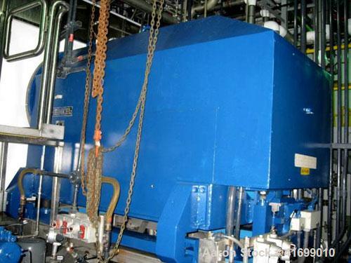 Used Heinkel Centrifuge, Model HF600-1, Hastelloy C22 (product contact sufaces). Rated 571/65 KG load. Includes drum lifting system and control panels. Built 2002.