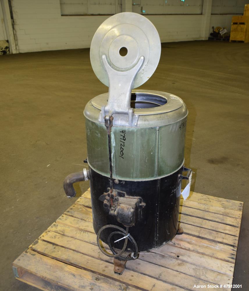 Used Bock Centrifugal Extractor, Model 24-B-C. 17" Diameter x 9" deep Alloy 400 perforated basket. 15 Pound dry capacity, top load & unload. Includes a top cover, and a manual brake. Driven by an app...