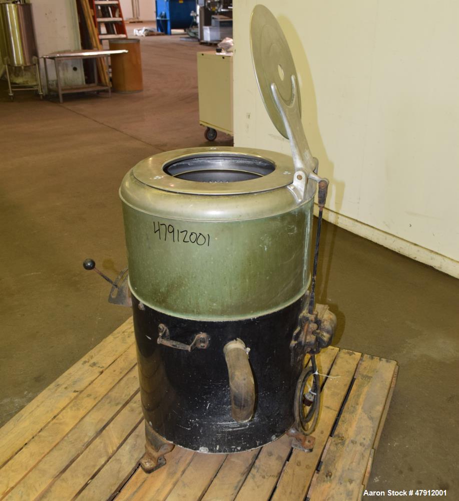 Used Bock Centrifugal Extractor, Model 24-B-C. 17" Diameter x 9" deep Alloy 400 perforated basket. 15 Pound dry capacity, top load & unload. Includes a top cover, and a manual brake. Driven by an app...