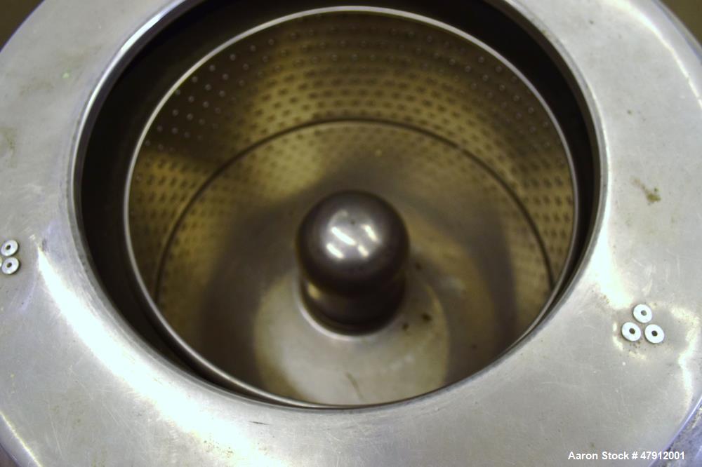 Used Bock Centrifugal Extractor, Model 24-B-C. 17" Diameter x 9" deep Alloy 400 perforated basket. 15 Pound dry capacity, top load & unload. Includes a top cover, and a manual brake. Driven by an app...