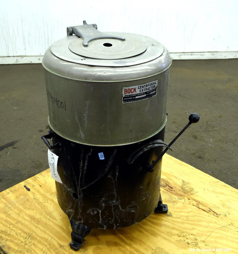 Used Bock Centrifugal Extractor, Model 24-BC. 17" Diameter x 9" deep Alloy 400 perforated basket. 15 Pound dry capacity, top load & unload. Includes a top cover, and a manual brake. Driven by an appr...