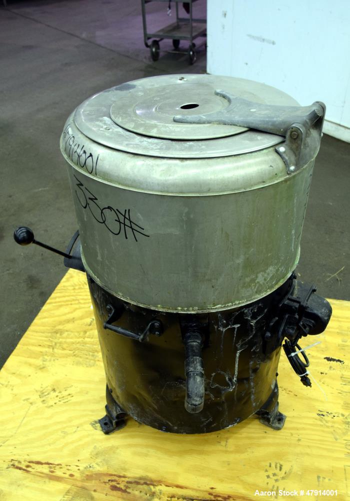 Used Bock Centrifugal Extractor, Model 24-BC. 17" Diameter x 9" deep Alloy 400 perforated basket. 15 Pound dry capacity, top load & unload. Includes a top cover, and a manual brake. Driven by an appr...