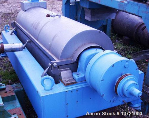 Used Alfa Laval decanter, type AVNX-418B-11G. 316 stainless steel construction on product contact parts. Max bowl speed 3000 rpm. Double row of cake discharge ports, 70 mm single lead conveyor with w...