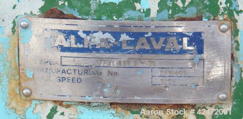 Used Alfa Laval decanter, type NX 418B-31G. 316 stainless steel construction on product contact parts. Approximate maximum bowl speed 4000. Single lead conveyor. Complete with gearbox.