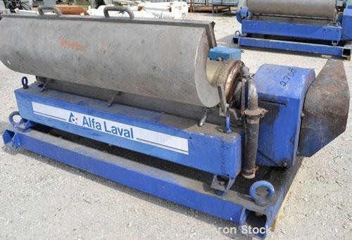 Used Alfa Laval NX-418-31 Solid Bowl Decanter Centrifuge. 316 Stainless steel construction on product contact parts. Max bowl speed 4000 rpm, 3 phase, 2 ¾" (70 mm) single lead conveyor with welded ha...
