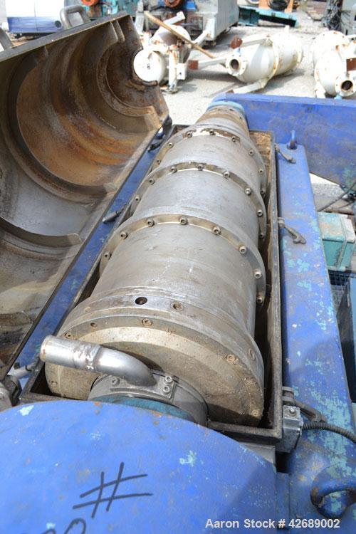 Used Alfa Laval NX-418S-31 Solid Bowl Decanter Centrifuge. 316 Stainless steel construction on product contact parts. Max bowl speed 4000 rpm, 3 phase, 2 ¾" (70 mm) single lead conveyor with welded h...