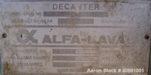 Used Alfa Laval NX-418B-31G Solid Bowl Decanter Centrifuge. 316 stainless steel construction on product contact areas, max bowl speed 4000 rpm. 70 mm single lead Esjberg conveyor with welded hardfaci...