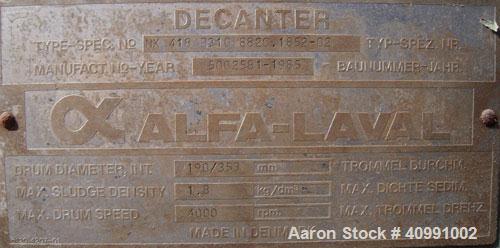 Used Alfa Laval NX-418B-31G Solid Bowl Decanter Centrifuge. 316 stainless steel construction on product contact areas, max bowl speed 4000 rpm. 70 mm single lead Esjberg conveyor with welded hardfaci...