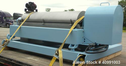 Used Alfa Laval NX-418B-31G Solid Bowl Decanter Centrifuge. 316 stainless steel construction on product contact areas, max bowl speed 4000 rpm. 70 mm single lead axial conveyor with welded hardfacing...