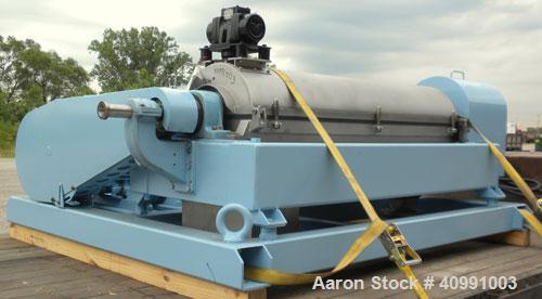 Used Alfa Laval NX-418B-31G Solid Bowl Decanter Centrifuge. 316 stainless steel construction on product contact areas, max bowl speed 4000 rpm. 70 mm single lead axial conveyor with welded hardfacing...
