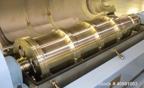 Used Alfa Laval NX-418B-31G Solid Bowl Decanter Centrifuge. 316 stainless steel construction on product contact areas, max bowl speed 4000 rpm. 70 mm single lead axial conveyor with welded hardfacing...