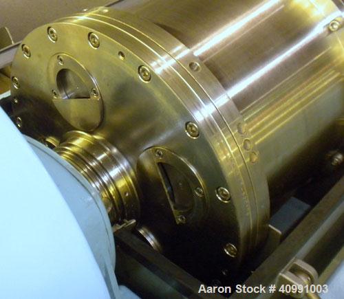 Used Alfa Laval NX-418B-31G Solid Bowl Decanter Centrifuge. 316 stainless steel construction on product contact areas, max bowl speed 4000 rpm. 70 mm single lead axial conveyor with welded hardfacing...