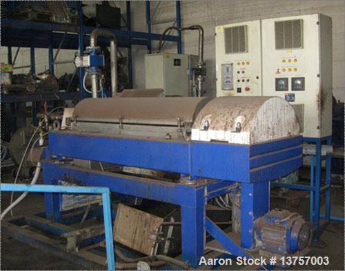 Used Alfa Laval CHNX-418-31G Solid Bowl Decanter Centrifuge. Max bowl speed 4000 rpm, single lead conveyor with hardfacing, lined solids discharge ports, liquid plate dams, base, casing, gearbox, fee...
