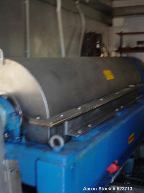 USED: Alfa Laval NX-5000 solid bowl decanter centrifuge, stainlesssteel construction on product contact areas. Max bowl speed 2700 rpm,base, casing, gearbox, pumps, mixers, hydraulic system. Complete...