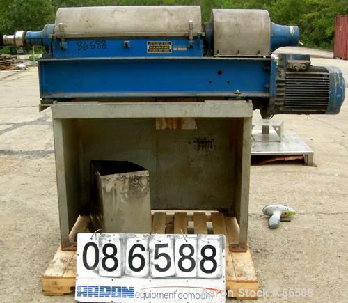 Used Alfa Laval NX-309S-31G Solid Bowl Decanter Centrifuge. Max bowl speed 5600 RPM, stainless steel construction on product contact areas, single lead conveyor, single row of cake discharge ports, b...