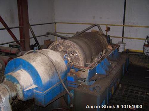 Used Sharples P-5000 Super-D-Canter Centrifuge. Stainless steel construction on product contact areas, maximum bowl speed 3000 rpm, 5" single lead conveyor, hogged out cake discharge ports, base, cas...