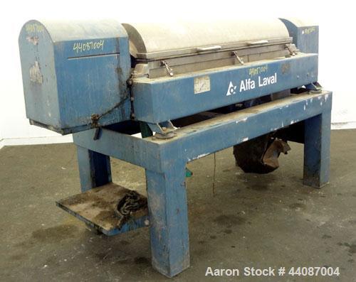 Used Alfa Laval UVNX-418 (2 or 3 phase) Solid Bowl Decanter Centrifuge. 316 Stainless steel (product contact areas). single lead conveyor, single row of lined cake discharge ports,cake discharge cage...