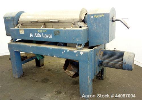 Used Alfa Laval UVNX-418 (2 or 3 phase) Solid Bowl Decanter Centrifuge. 316 Stainless steel (product contact areas). single lead conveyor, single row of lined cake discharge ports,cake discharge cage...