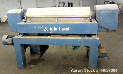 Used Alfa Laval UVNX-418 (2 or 3 phase) Solid Bowl Decanter Centrifuge. 316 Stainless steel (product contact areas). single lead conveyor, single row of lined cake discharge ports,cake discharge cage...