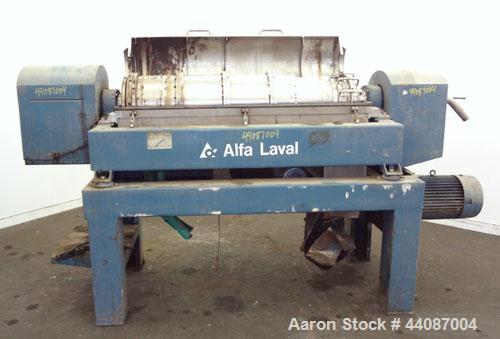 Used Alfa Laval UVNX-418 (2 or 3 phase) Solid Bowl Decanter Centrifuge. 316 Stainless steel (product contact areas). single lead conveyor, single row of lined cake discharge ports,cake discharge cage...