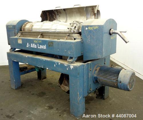Used Alfa Laval UVNX-418 (2 or 3 phase) Solid Bowl Decanter Centrifuge. 316 Stainless steel (product contact areas). single lead conveyor, single row of lined cake discharge ports,cake discharge cage...