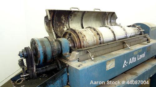 Used Alfa Laval UVNX-418 (2 or 3 phase) Solid Bowl Decanter Centrifuge. 316 Stainless steel (product contact areas). single lead conveyor, single row of lined cake discharge ports,cake discharge cage...