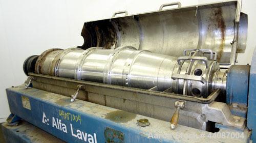 Used Alfa Laval UVNX-418 (2 or 3 phase) Solid Bowl Decanter Centrifuge. 316 Stainless steel (product contact areas). single lead conveyor, single row of lined cake discharge ports,cake discharge cage...