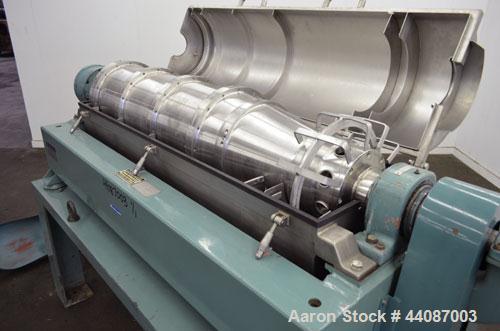 Used Alfa Laval UVNX-418 (2 or 3 phase) Solid Bowl Decanter Centrifuge. 316 Stainless steel (product contact areas). single lead conveyor, single row of lined cake discharge ports,  cake discharge ca...