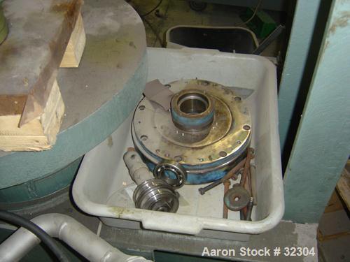 USED: Dorr-Oliver 12L solid bowl decanter centrifuge, 316 stainless steel. Max bowl speed 5500 rpm, 8 deg contour bowl, centripetal pump on liquid discharge, cake discharge race track, external pool ...