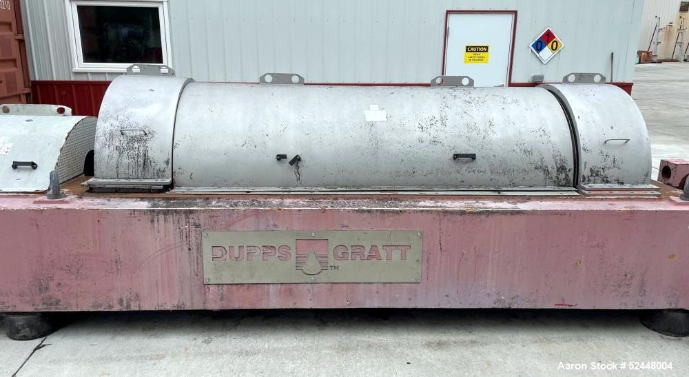 Used Dupps Model GMT808 Decanter Centrifuge. Stainless steel construction. 3" Feed, 8" liquid phase outlet, 16-15/16" x 46-7/8" solid phase outlet. Rotating assembly & base.