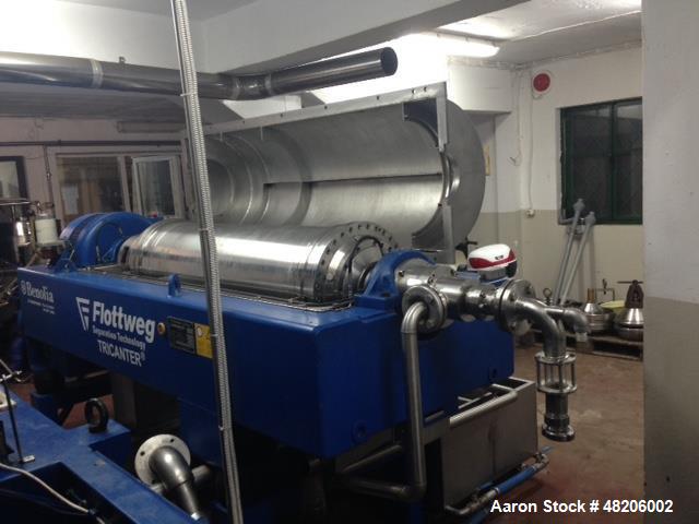 Used Flottweg Z4E-4/444 Tricanter Solid Bowl Decanter Centrifuge. Maximum bowl speed 3800 rpm, three phase separation (liquid/liquid/solids separation), steep angle bowl design, conveyor, base, casin...