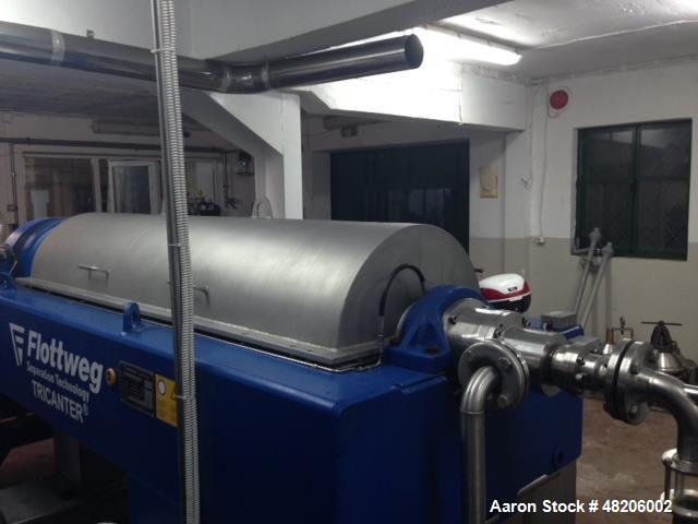Used Flottweg Z4E-4/444 Tricanter Solid Bowl Decanter Centrifuge. Maximum bowl speed 3800 rpm, three phase separation (liquid/liquid/solids separation), steep angle bowl design, conveyor, base, casin...