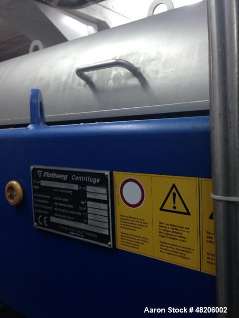 Used Flottweg Z4E-4/444 Tricanter Solid Bowl Decanter Centrifuge. Maximum bowl speed 3800 rpm, three phase separation (liquid/liquid/solids separation), steep angle bowl design, conveyor, base, casin...
