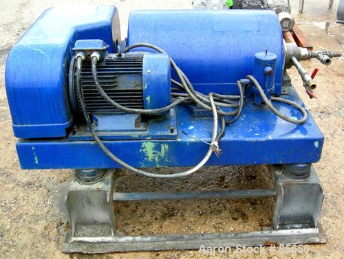 USED: Flottweg solid bowl horizontal decanter centrifuge, model ZL1, 319 stainless steel. Approximate 9" bowl diameter, 6000 bowl rpm, max density 5G/CM3, temp range 90 deg C. Approximate 3" hard fac...