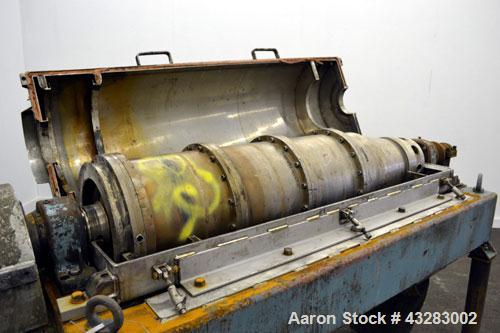Used Alfa Laval NX-418 (2 or 3 phase) Solid Bowl Decanter Centrifuge. 316 Stainless steel construction (product contact areas), maximum bowl speed 3250 rpm, single row of lined cake discharge ports, ...