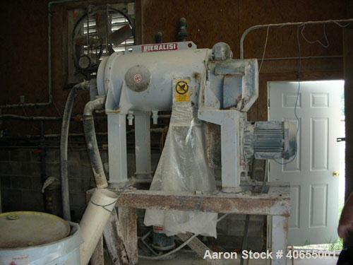 Used Pieralisi model Baby 1 solid bowl decanter centrifuge. Max bowl speed 5200 rpm, 35000 x "G" force. Includes casing/stand, cyclo gearbox, 5.5 kW drive motor, feed pipe, control.