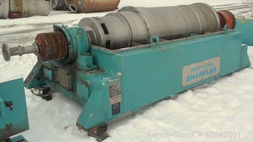 Used Sharples DS-705 Super-D-Canter Centrifuge, 317 stainless steel construction (product contact areas), 10" single lead conveyor with STC tiles, 360 degree solid discharge ports with replaceable si...