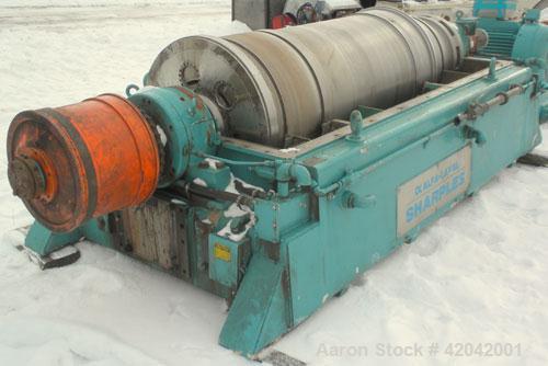 Used Sharples DS-705 Super-D-Canter Centrifuge, 317 stainless steel construction (product contact areas), 10" single lead conveyor with STC tiles, 360 degree solid discharge ports with replaceable si...
