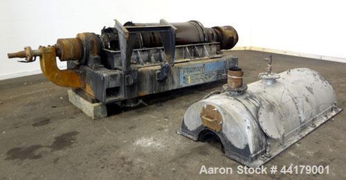 Used Sharples P-5000 Super-D-Canter Centrifuge. 316 Stainless steel product contact areas. Maximum bowl speed approximate 3000 rpm. 5" Pitch conveyor, base, casing, cover, and feed pipe.