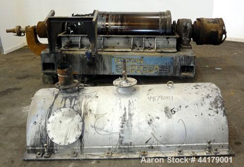 Used Sharples P-5000 Super-D-Canter Centrifuge. 316 Stainless steel product contact areas. Maximum bowl speed approximate 3000 rpm. 5" Pitch conveyor, base, casing, cover, and feed pipe.