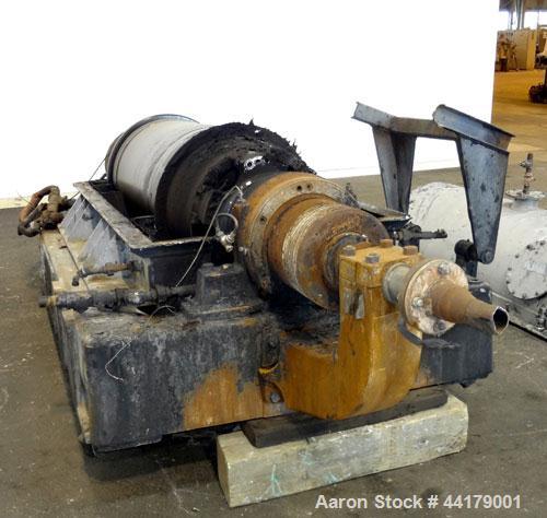 Used Sharples P-5000 Super-D-Canter Centrifuge. 316 Stainless steel product contact areas. Maximum bowl speed approximate 3000 rpm. 5" Pitch conveyor, base, casing, cover, and feed pipe.