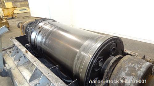 Used Sharples P-5000 Super-D-Canter Centrifuge. 316 Stainless steel product contact areas. Maximum bowl speed approximate 3000 rpm. 5" Pitch conveyor, base, casing, cover, and feed pipe.