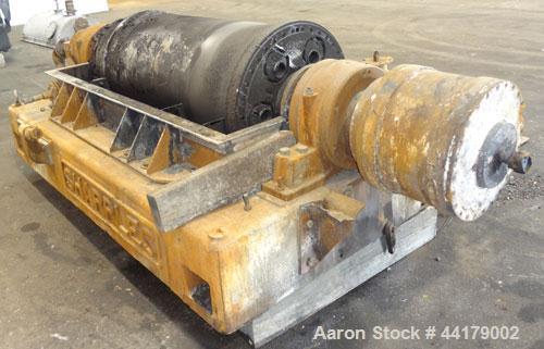 Used Sharples P-5000 Super-D-Canter Centrifuge. 316 Stainless steel product contact areas. Maximum bowl speed 3000 rpm. 5" Pitch conveyor, base, casing, cover, and feed pipe.